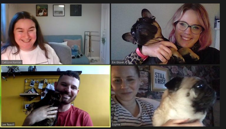 Victress team video meeting showing the team - three girls and a guy holding two dogs and a cat